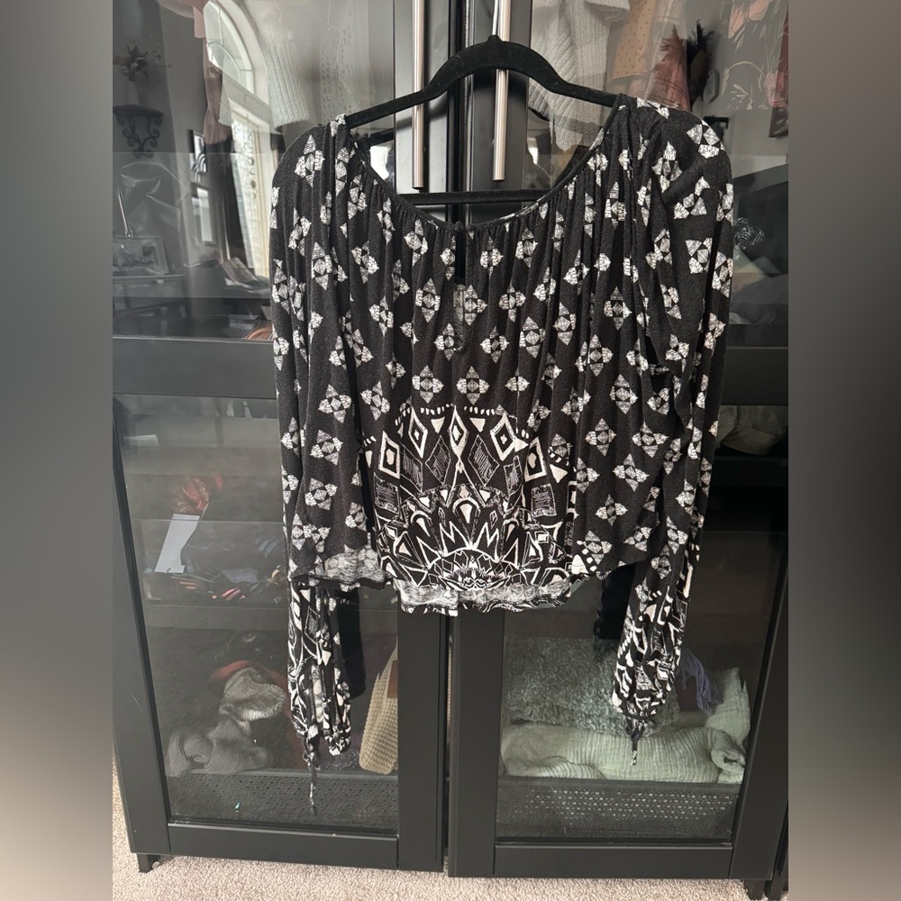 Free People black and white long sleeve cut out shirt, size medium.